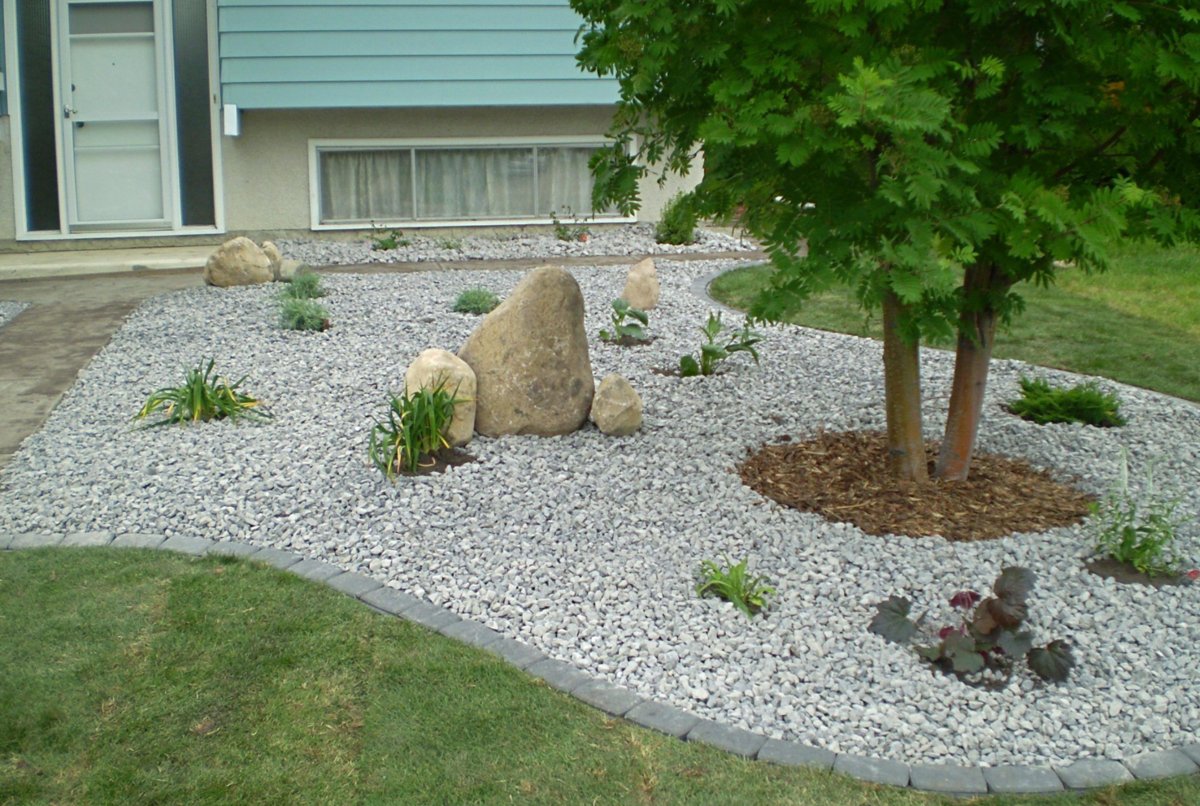Grey gravel garden with boulders